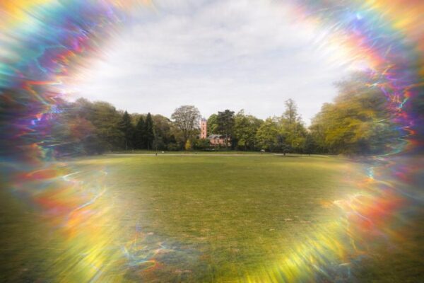 Cartoon pink brain character crying on yellow background with text "Wait that's a migraine symptom?" representing unexpected neurological symptoms of migraine