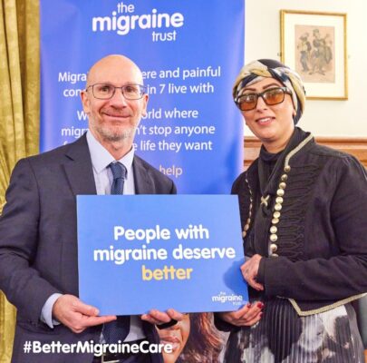 a image showing misba the owner of aura clarity getting the parliament award